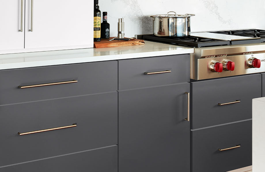 Modern kitchen with dark blue cabinets, stainless steel appliances