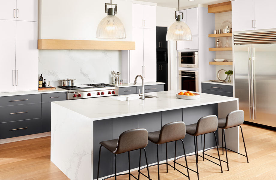 Modern kitchen with white island, dark blue cabinets made with FENIX panel